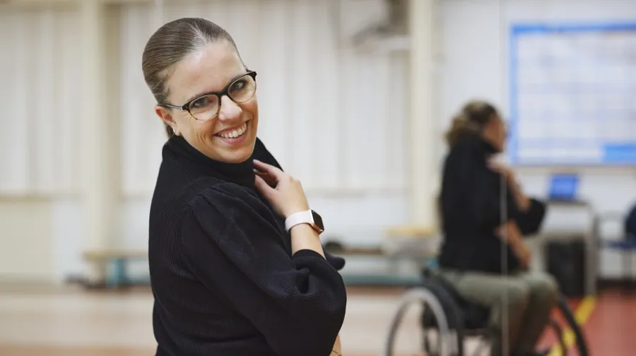 Portrait photo of a catheter use in a dance studio. Initially, doctors tried to manage her bladder with medication, but the situation didn’t improve. Then she was prescribed intermittent catheters.  