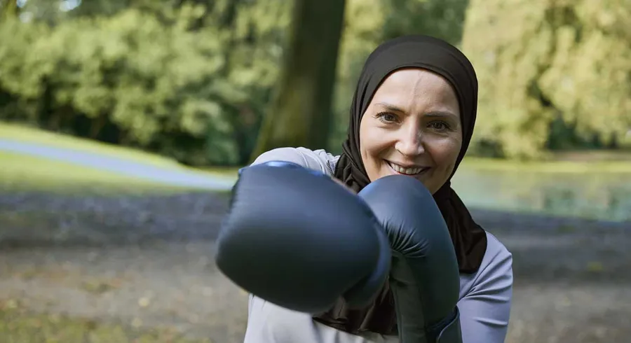 Image of Fikria outside with boxing gloves